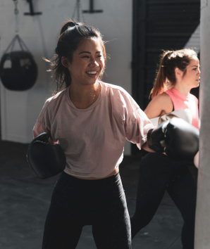 Two female students boxing