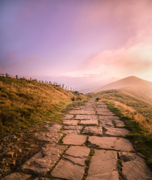 Path in the Peak District leading into the sunrise